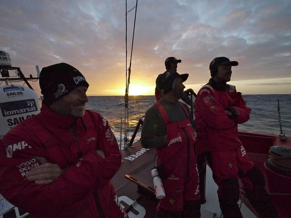 A light hearted sunset gathering on deck on CAMPER.